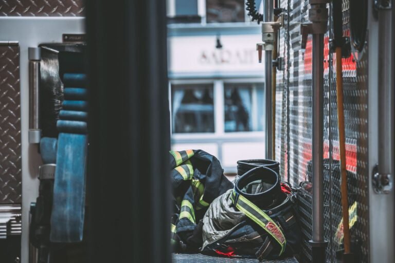 AFFF lawsuit: firefighter turnout coat and gear resting inside a fire engine