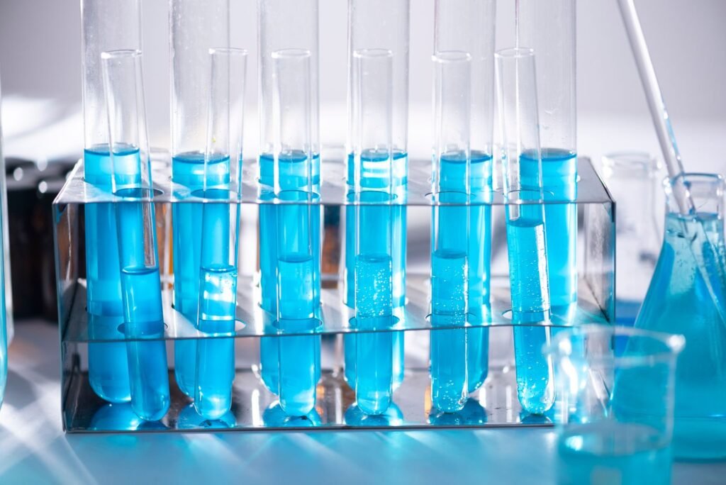 Bard PowerPort lawsuit: row of laboratory test tubes filled with blue liquid