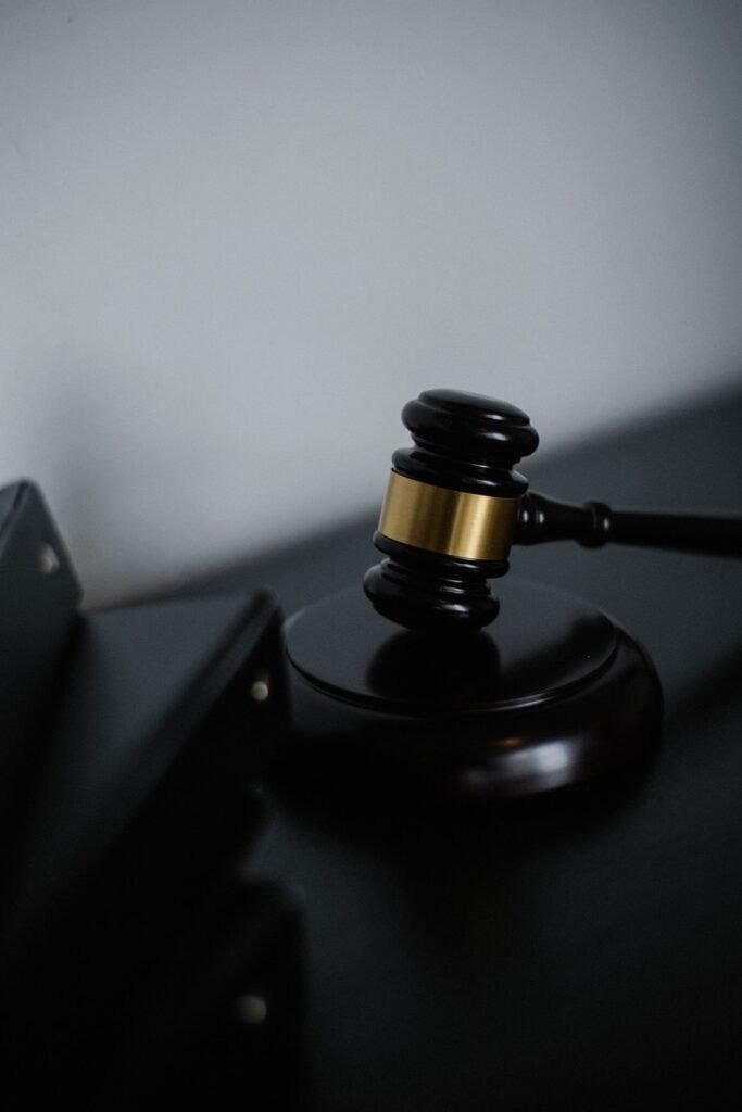 Bard PowerPort lawsuits: black wooden gavel with a gold band resting on a desk