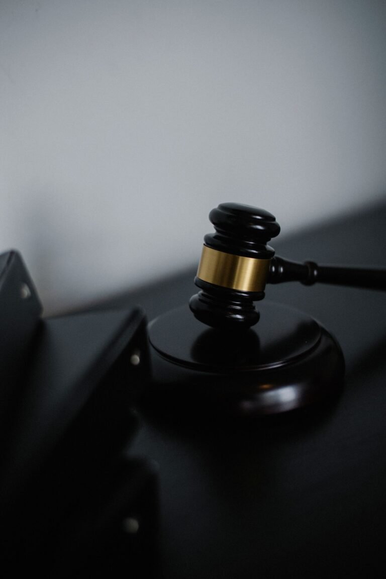 Bard PowerPort lawsuits: black wooden gavel with a gold band resting on a desk