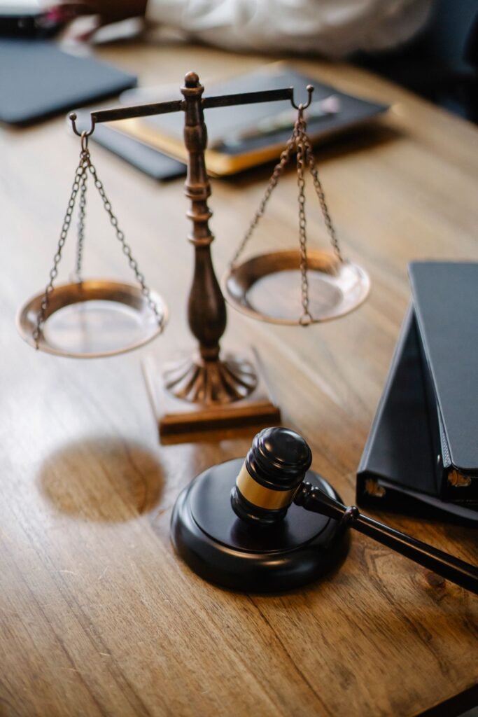 Bard PowerPort lawsuits: brass scales of justice and a gavel on a wooden judge's desk
