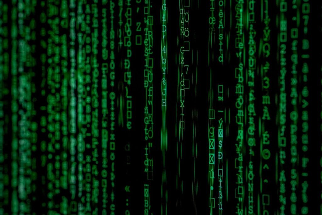 Roblox Robux addiction: green computer code on a dark screen, representing personal data