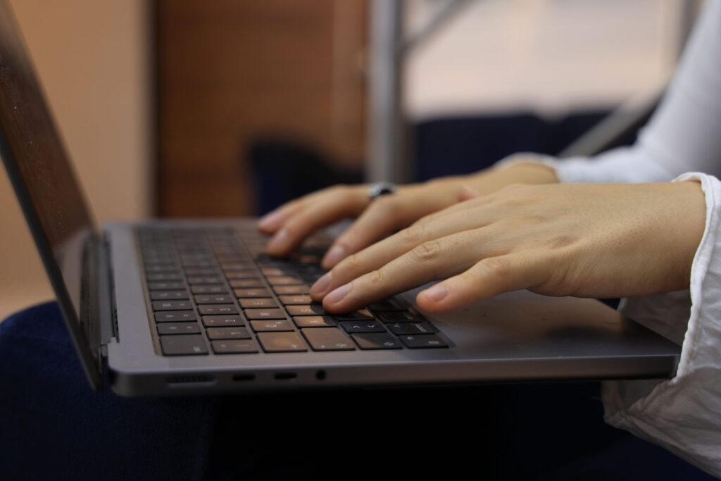 Chlorpyrifos claims: hands typing on a laptop keyboard while filling out an online case review form