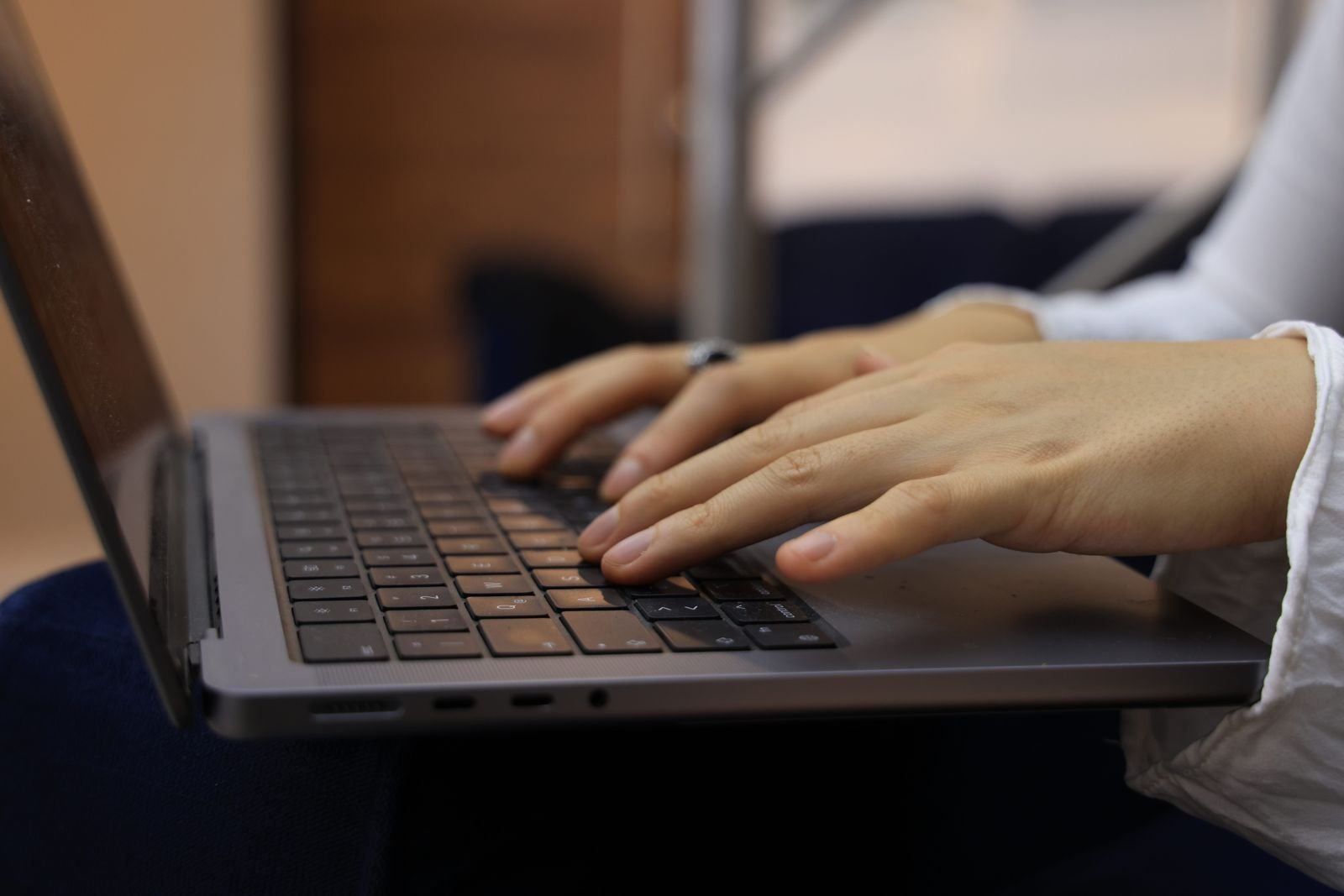 Chlorpyrifos claims: hands typing on a laptop keyboard while filling out an online case review form