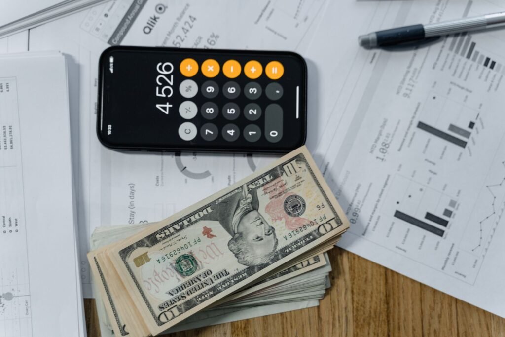 Depo-Provera lawsuit: calculator and paperwork on a desk, representing tracking medical costs and losses