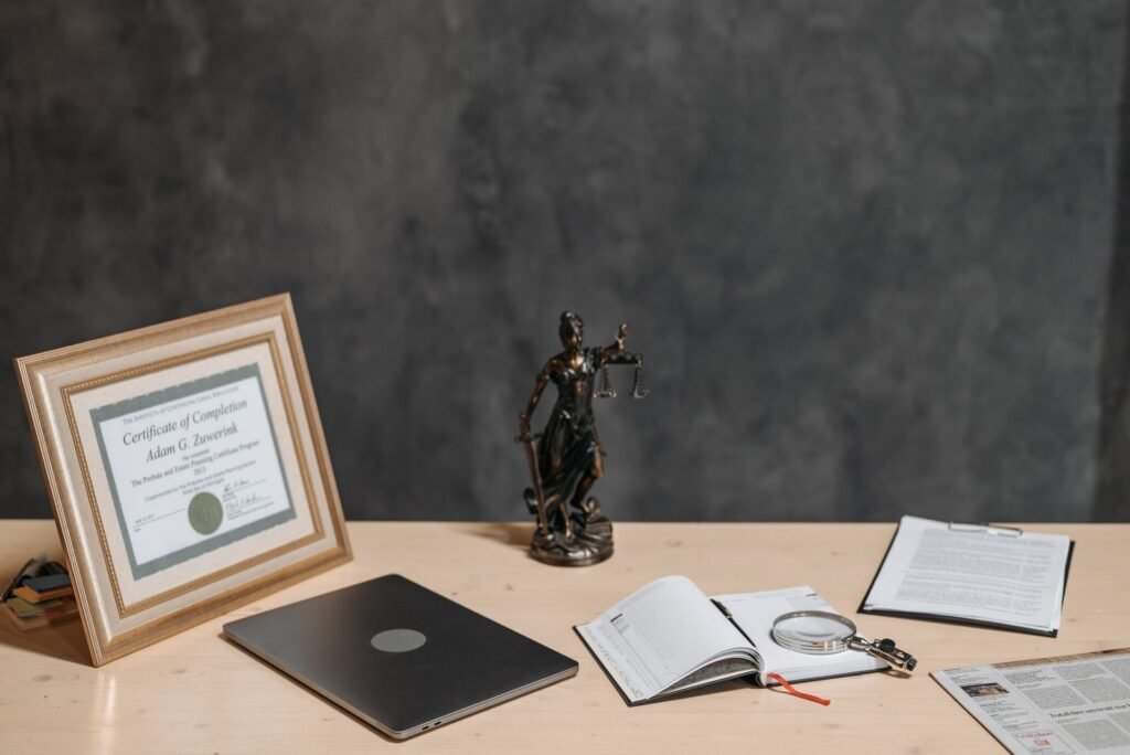 Dupixent lawsuit update: desk with a Lady Justice figurine, legal documents and a magnifying glass