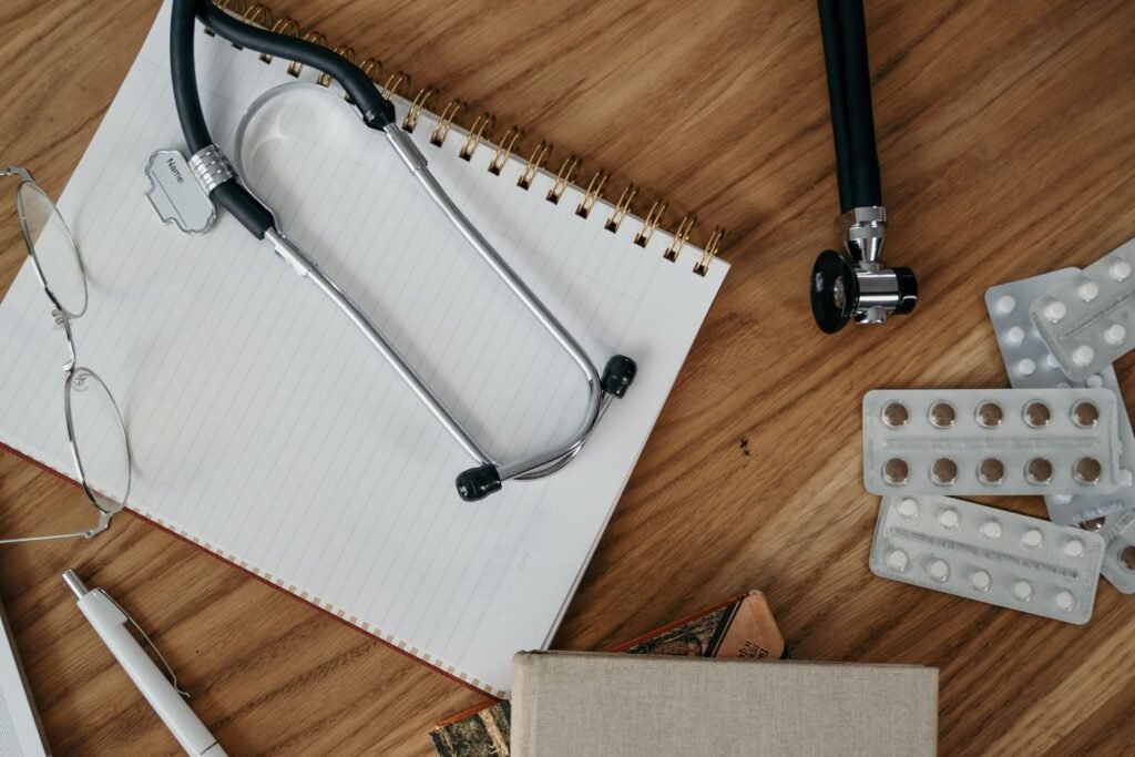 Bard PowerPort free case review: stethoscope, notebook, pen and medicine on a wooden desk