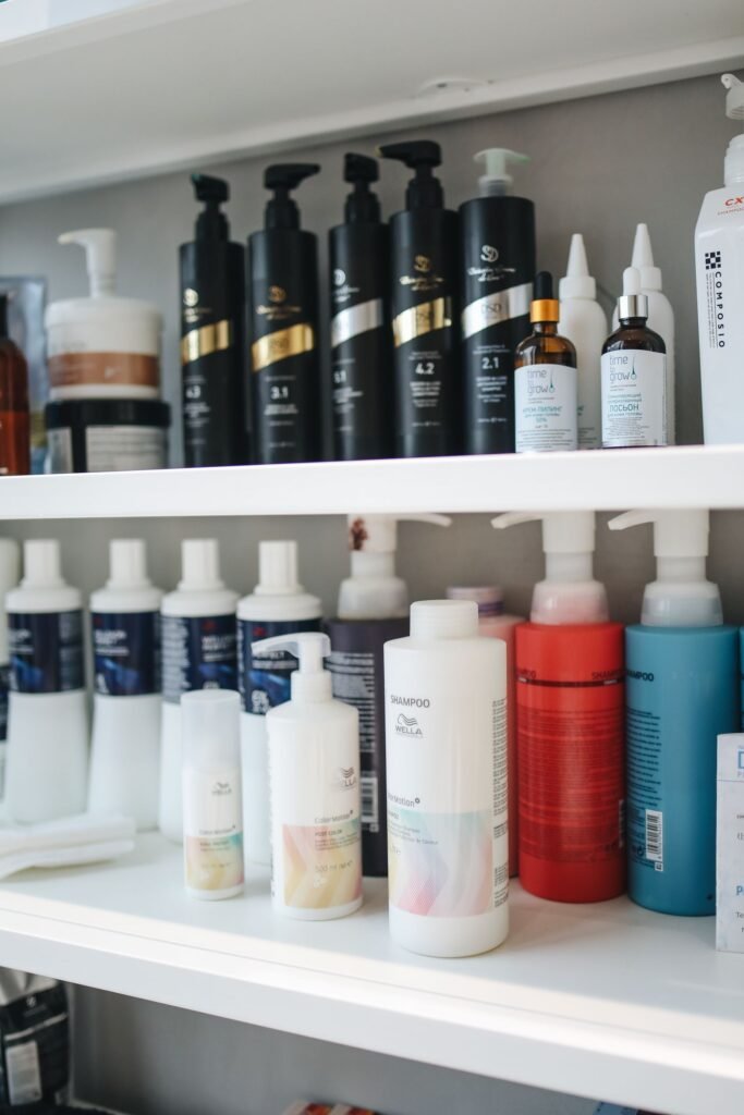 Hair relaxer lawsuits 2026: plastic shampoo and conditioner bottles lined up on a store shelf