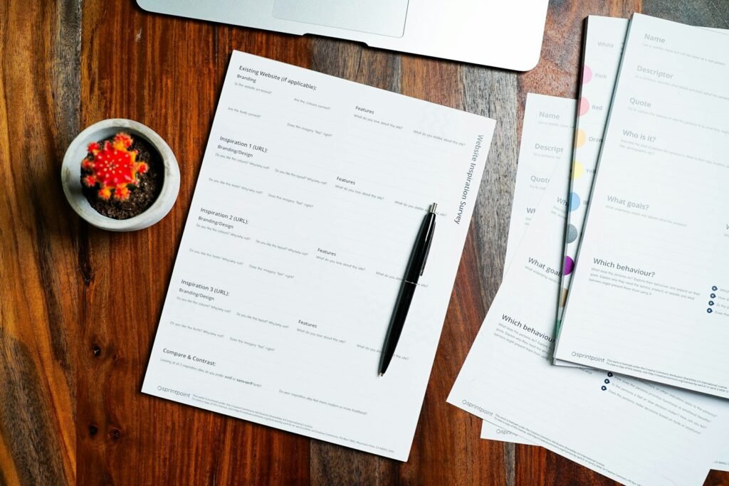 Cartiva settlement: papers and a pen spread across a wooden desk next to a laptop