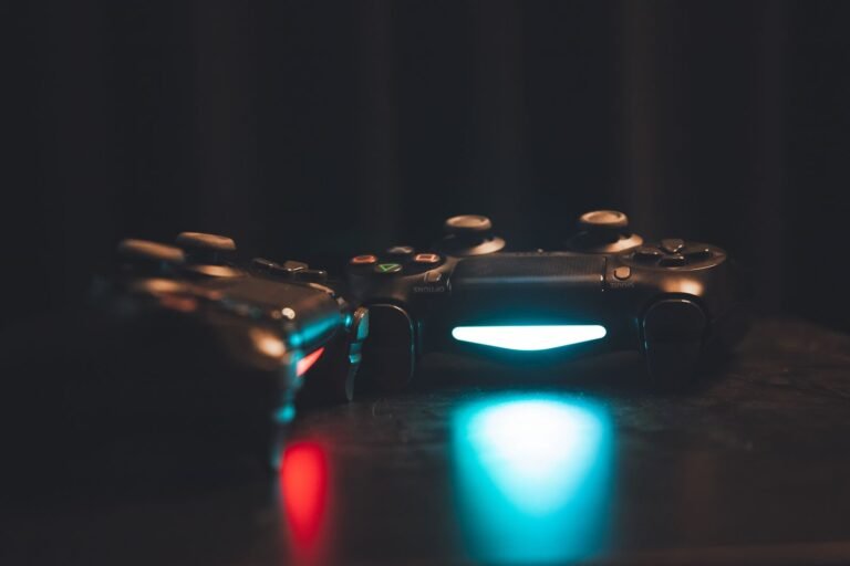 Roblox harm: two game controllers glowing on a dark surface
