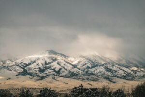 LDS abuse statute of limitations: snow-covered Utah mountain range under a cloudy sky