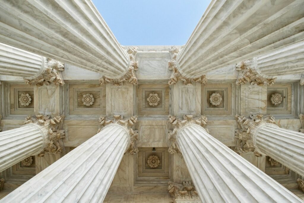 LDS abuse statute of limitations: looking up at tall gray stone columns of a government building