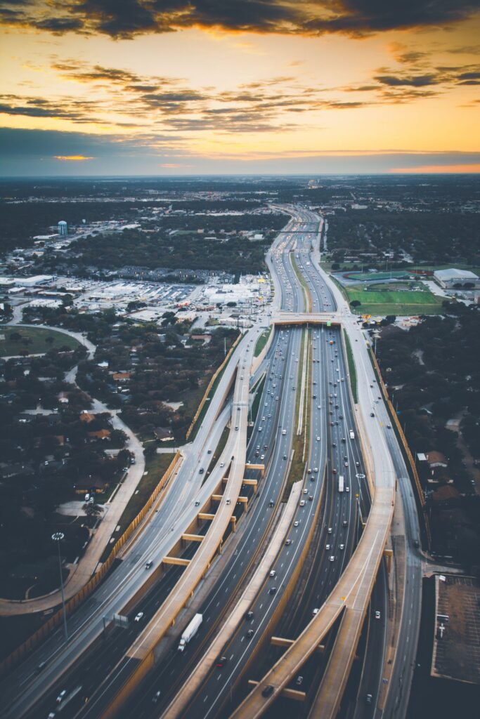 Car crash lawsuits: aerial view of traffic on a busy U.S. expressway at sunset