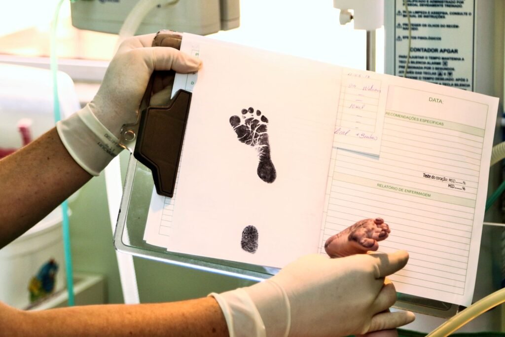 NEC and preemie formula: newborn footprint being recorded on hospital paperwork