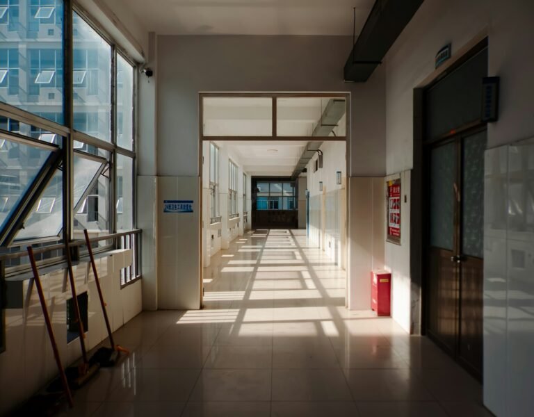 Northwell sleep center lawsuit: long empty hallway with sunlight casting shadows on the floor