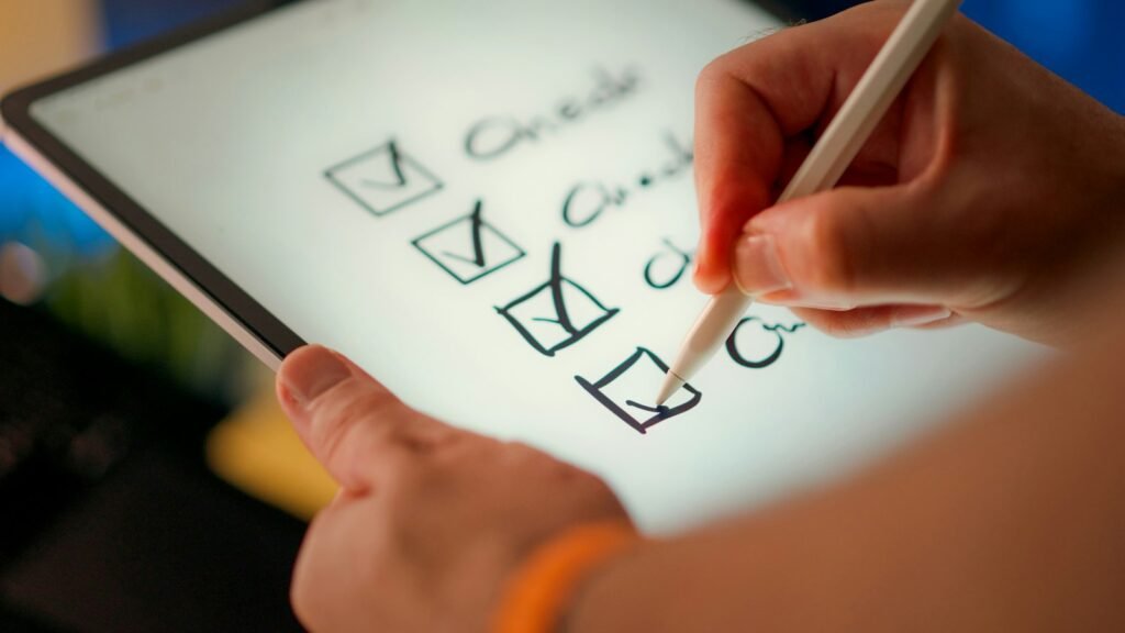 Northwell sleep center lawsuit: hand using a stylus to tick off items on a checklist on a tablet screen