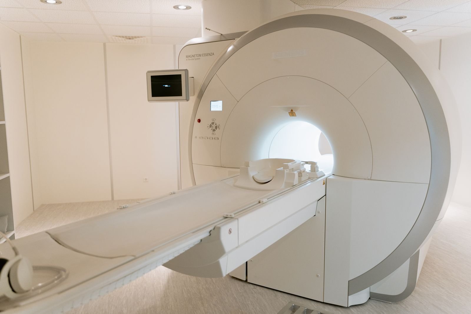 Empty MRI scanner in a bright hospital imaging room