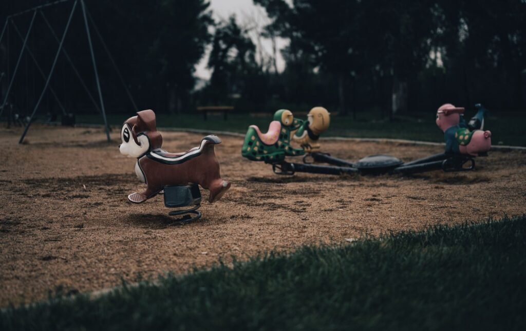 Pesticide drift exposure: empty playground with animal spring rides on a cloudy day