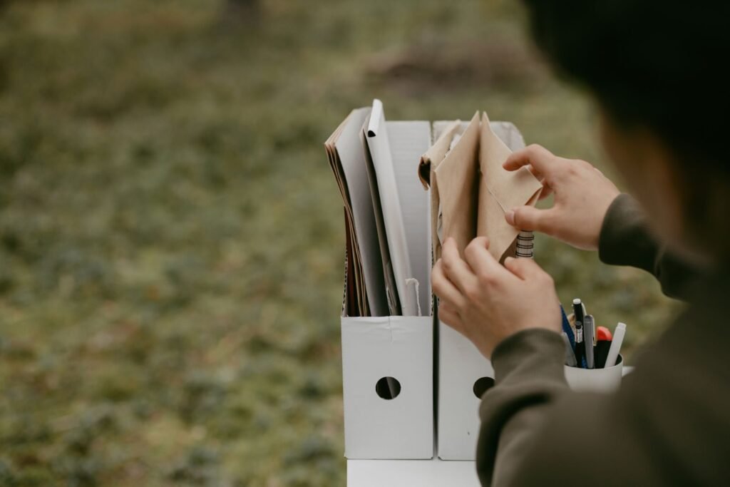 Chlorpyrifos exposure evidence: hands sorting documents in folders, no face visible
