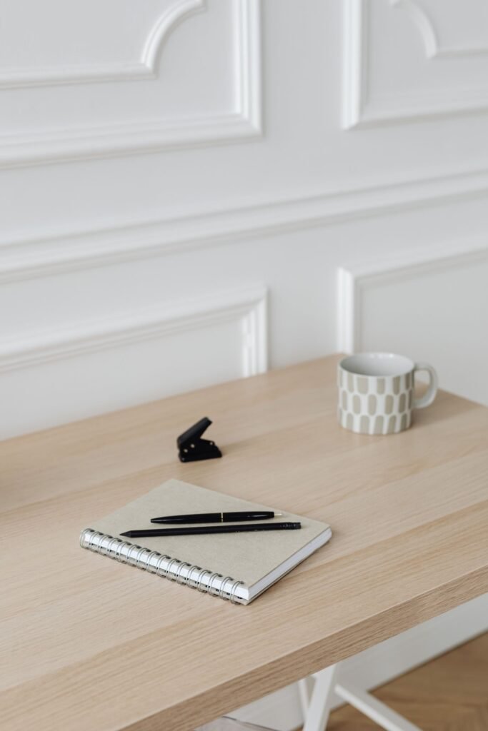 Rideshare assault case review: notebook, pen and mug on a wooden table