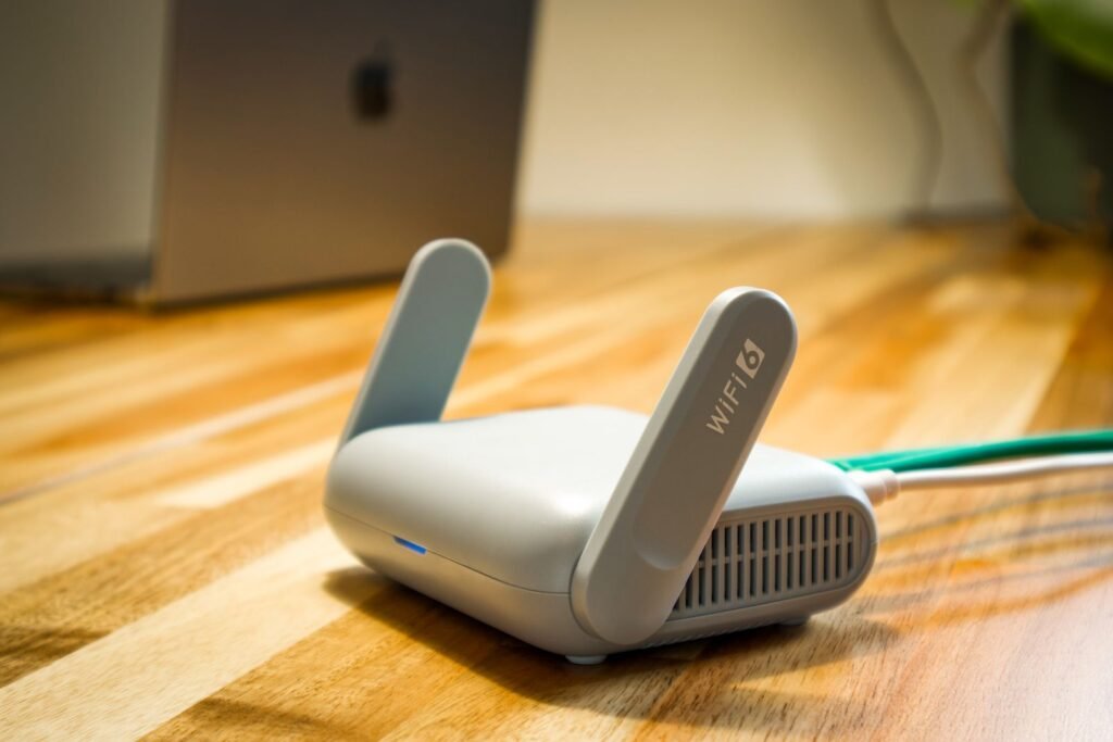 Roblox lawsuits: wireless router with antennas on a wooden desk