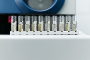 Roundup science: row of labeled test tubes on a rack in a laboratory