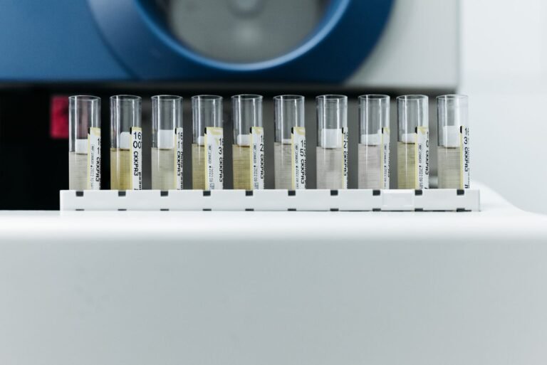 Roundup science: row of labeled test tubes on a rack in a laboratory