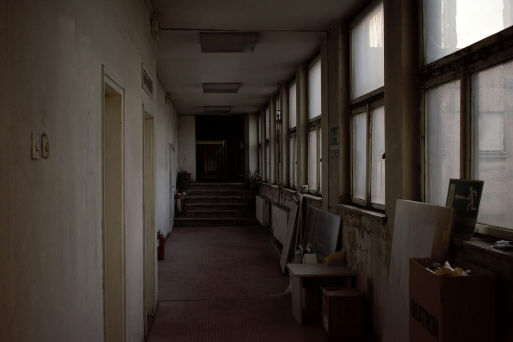Maryland detention center abuse: long hallway of an old building lit by a row of windows