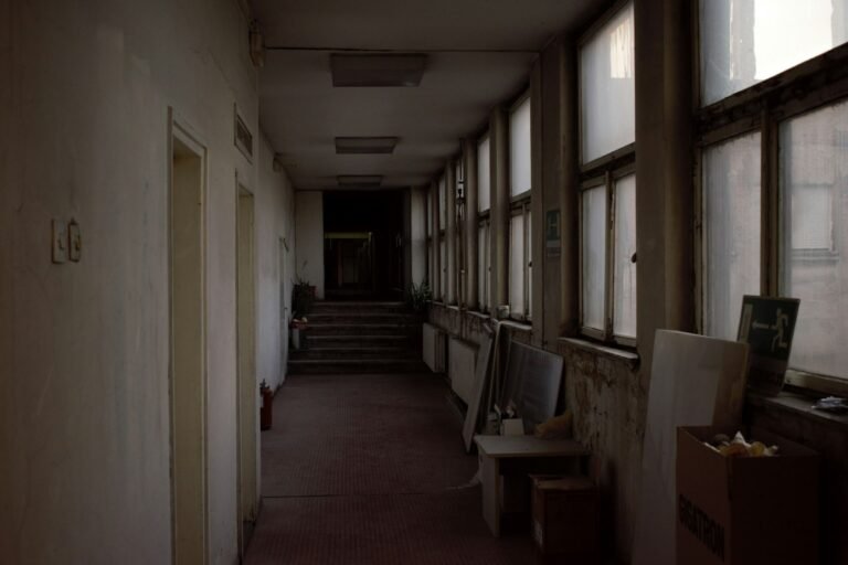Maryland detention center abuse: long hallway of an old building lit by a row of windows