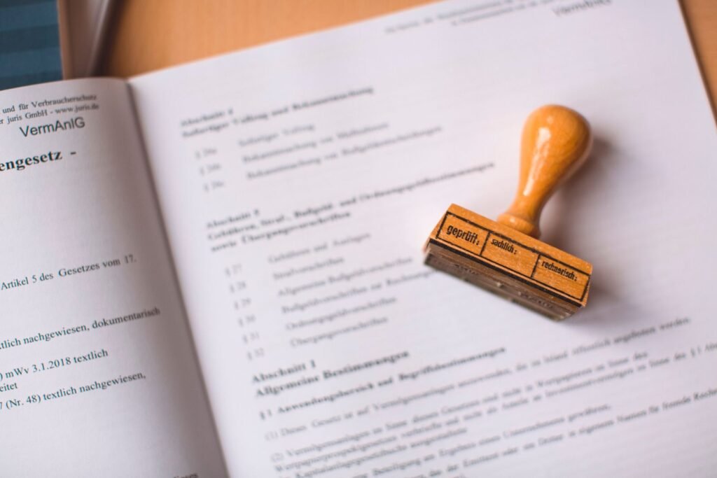 Roblox lawsuit: wooden stamp resting on the pages of a legal document