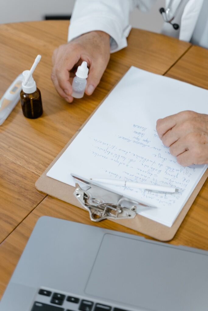 Transvaginal mesh lawsuit: doctor's hand holding medicine over patient notes on a clipboard