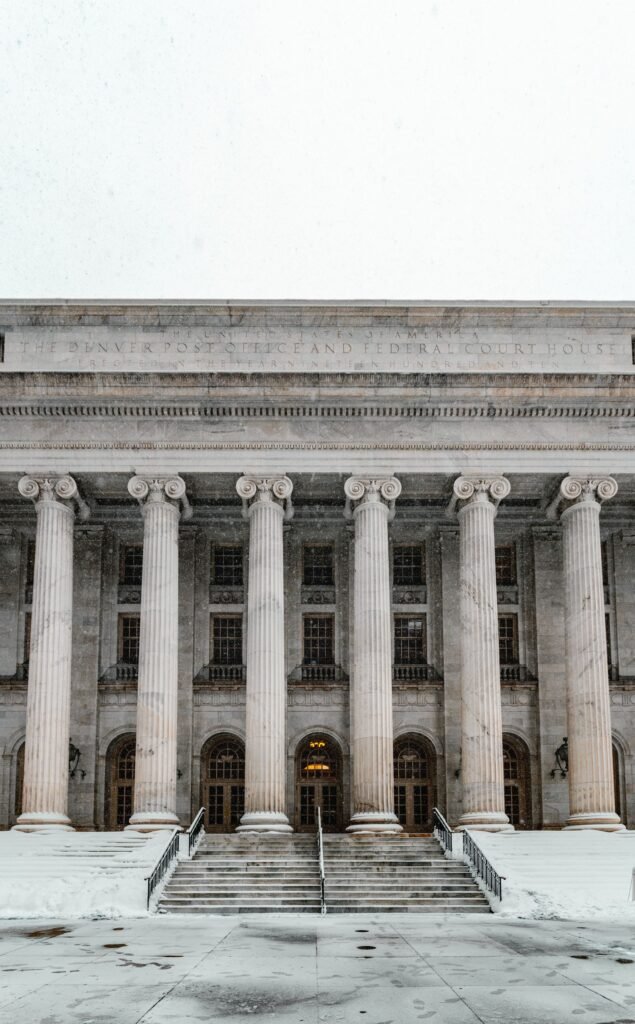 Uber and Lyft assault lawsuits: federal courthouse facade with columns and steps covered in snow