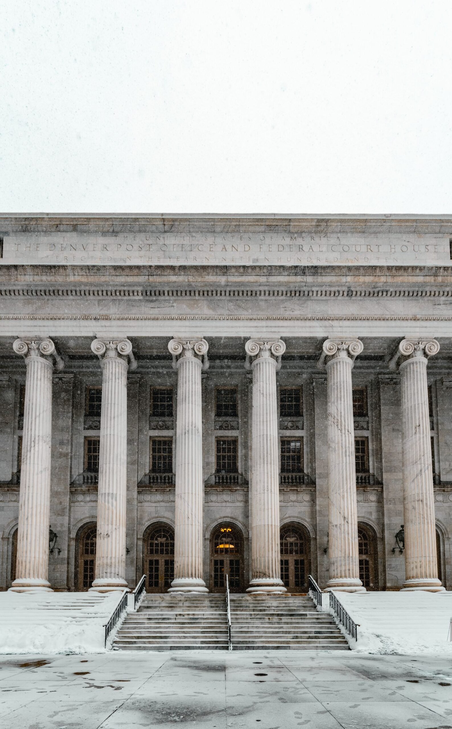 Uber and Lyft assault lawsuits: federal courthouse facade with columns and steps covered in snow