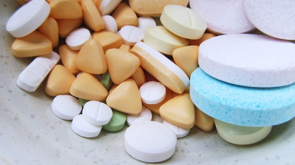 Zantac lawsuits: assorted unbranded pills and tablets on a neutral surface