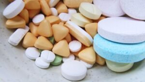 Zantac lawsuits: assorted unbranded pills and tablets on a neutral surface