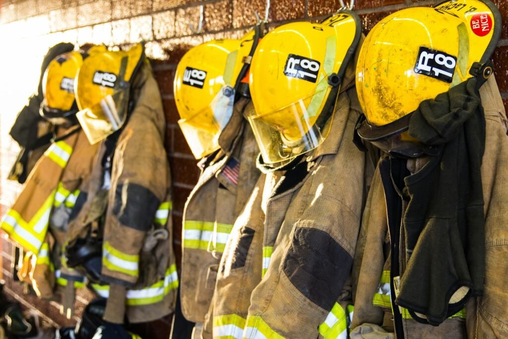 Firefighter turnout gear hanging in a station, a reminder of the jobs behind many AFFF lawsuit claims