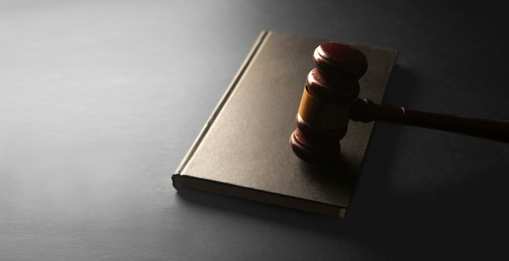 Wooden gavel resting on a closed law book, representing the Bard PowerPort lawsuit in federal court