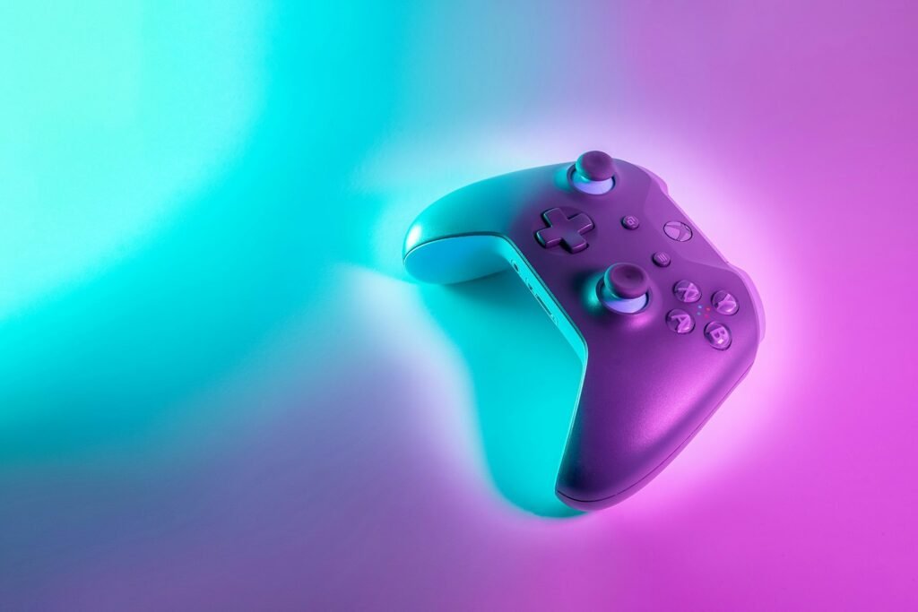 Game controller lit by neon light, a reminder of how Roblox Robux addiction can start with long play sessions