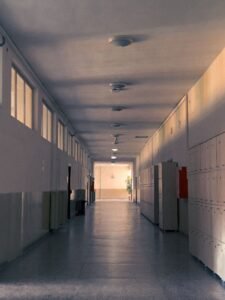 California sb 577: empty school hallway with rows of lockers