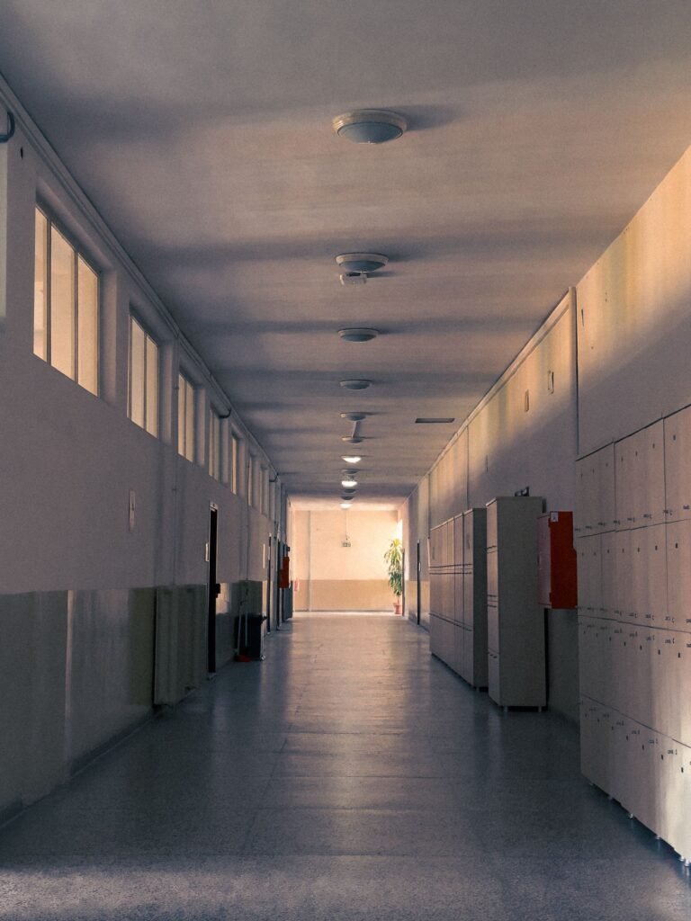 California sb 577: empty school hallway with rows of lockers
