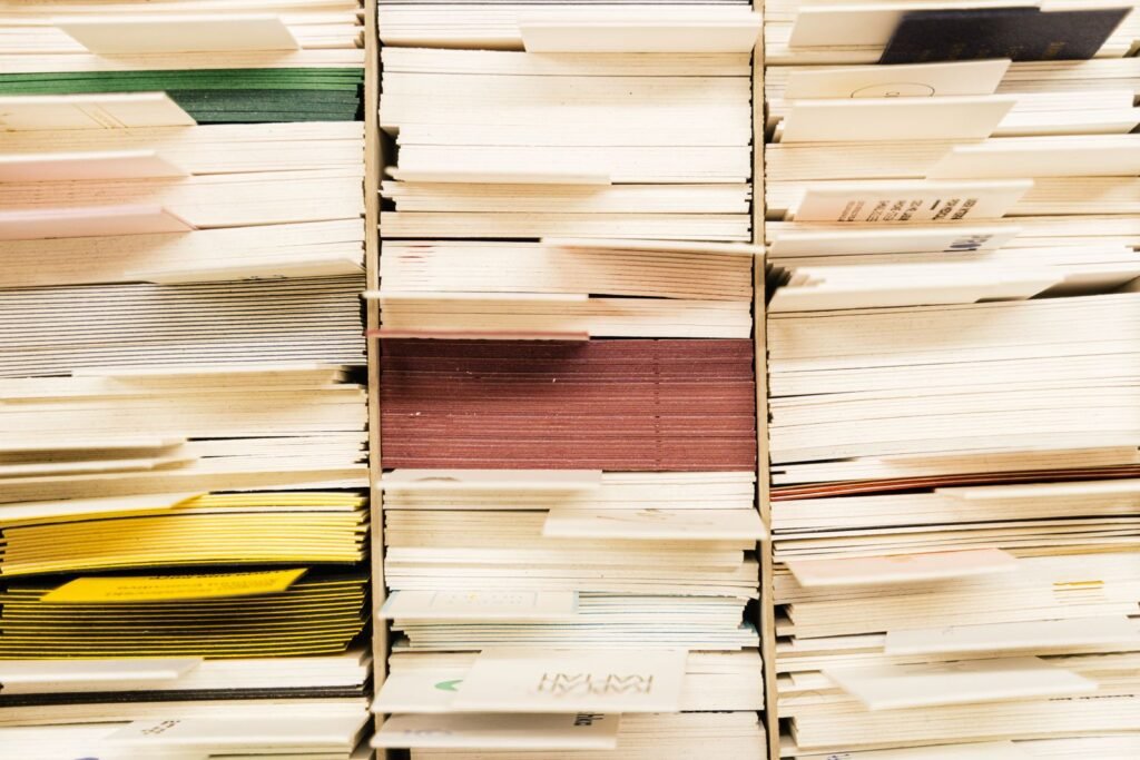 Stacks of colorful documents in a filing system, representing prison and medical records