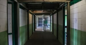 Empty institutional corridor representing CIW abuse lawsuit eligibility for former prisoners