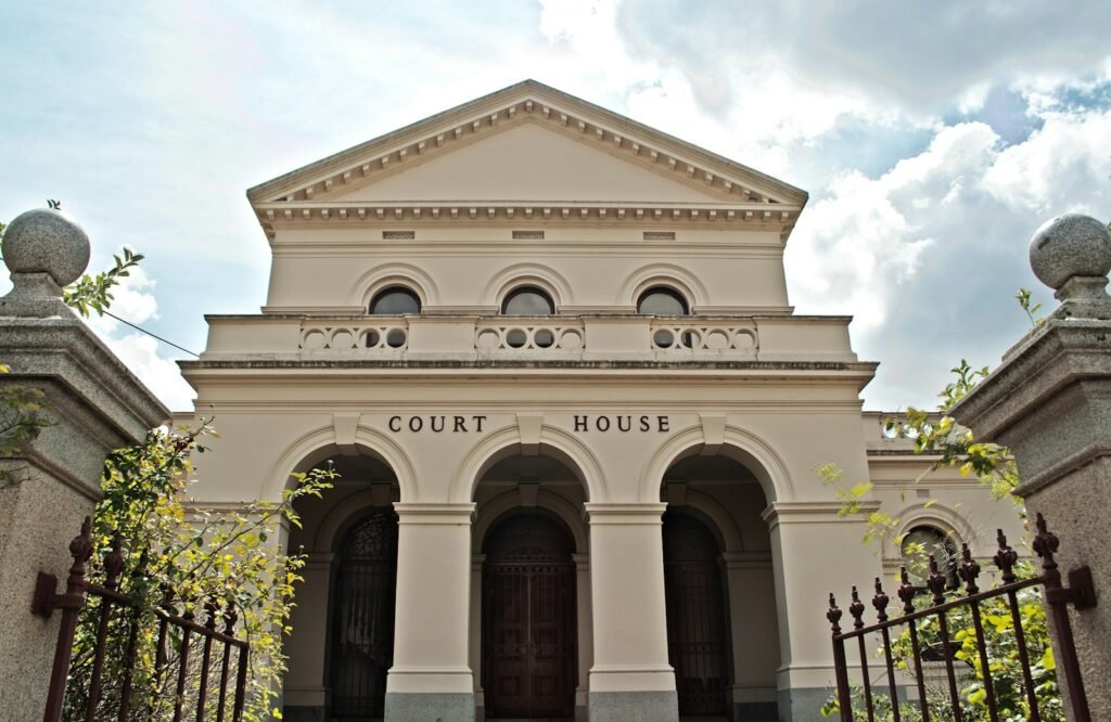 Historic courthouse building behind a gate, a reminder of the court overseeing the Depo-Provera settlement
