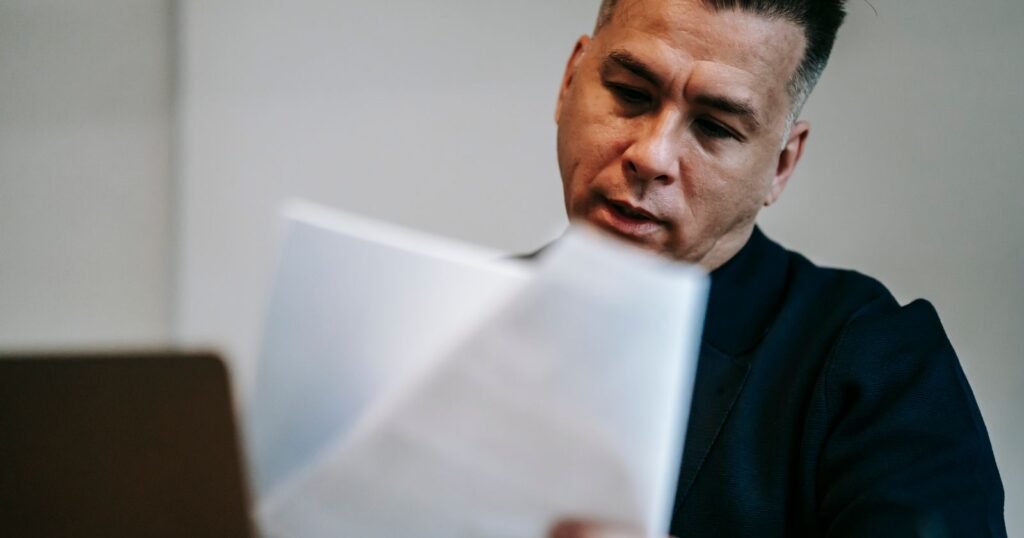 Man reviewing a Social Security disability benefits letter at his desk