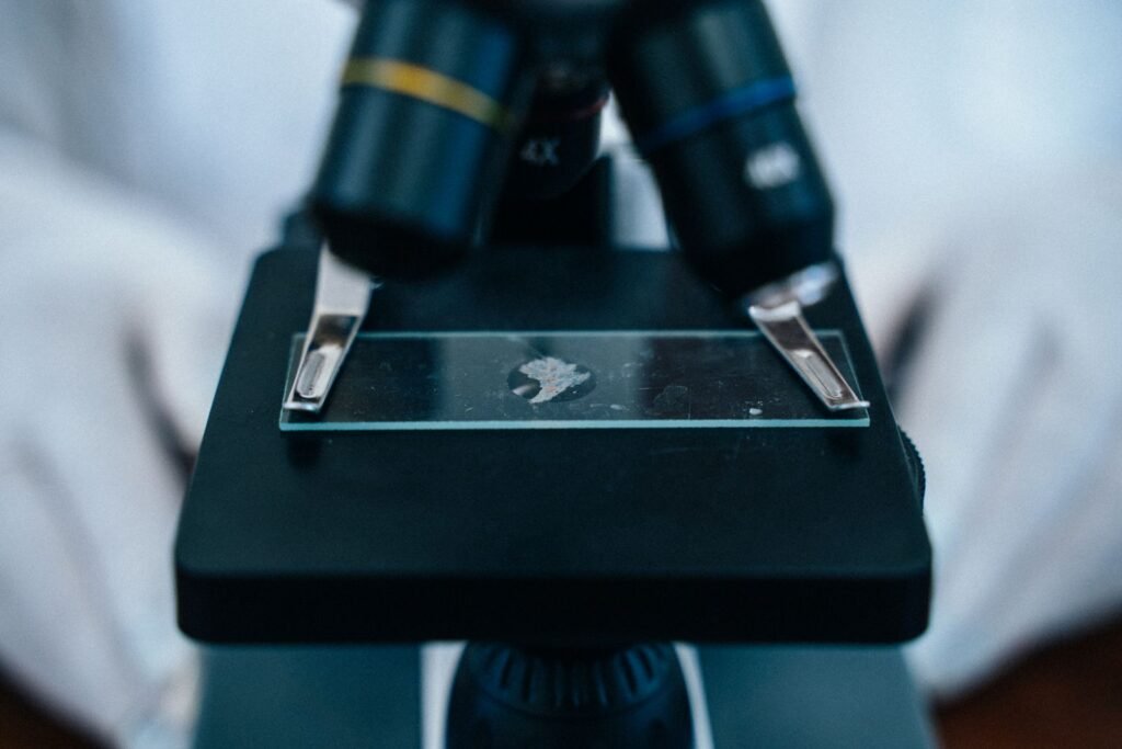 Microscope eyepiece and glass slide in a lab, reflecting the testing behind the Dupixent FDA safety review