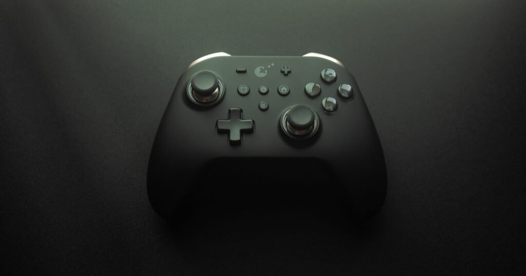 Video game controller resting in a dark room, illustrating gaming disorder symptoms