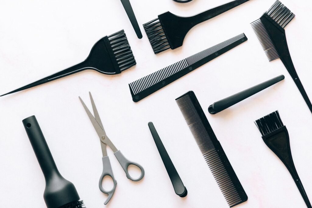 Combs, brushes and salon tools on a white background, linked to product use in hair relaxer lawsuits 2026