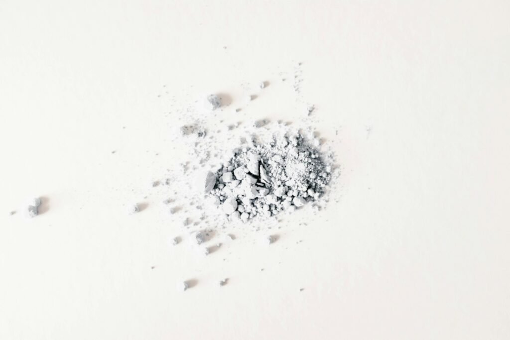 Small pile of white powder on a table, a reminder of the products at issue in a talcum powder lawsuit