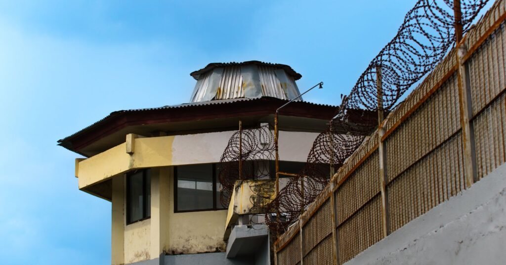 Watchtower and wire fence at a juvenile detention facility