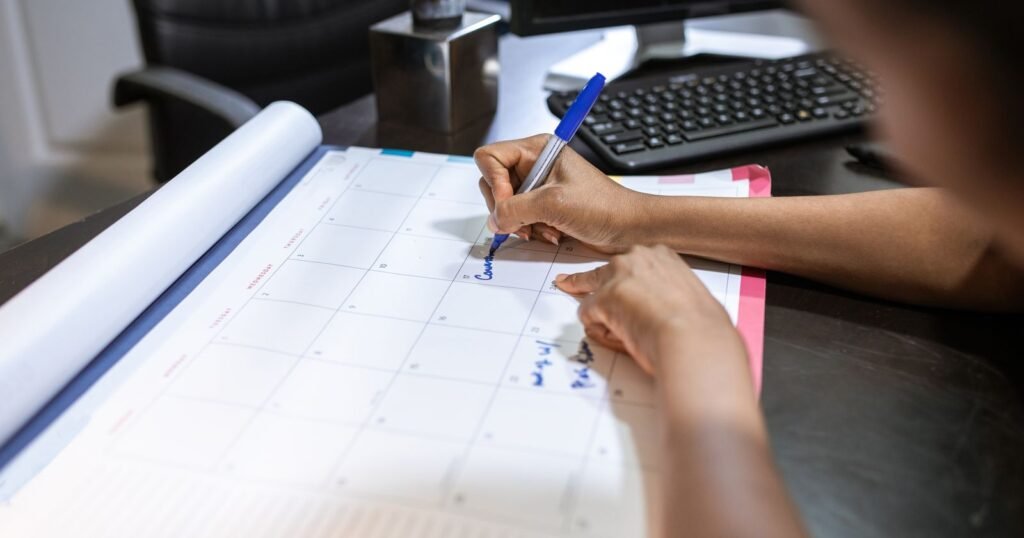 Person marking dates on a desk calendar, representing juvenile hall abuse deadlines in California